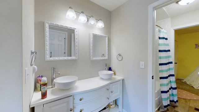 bathroom featuring vanity and a textured ceiling