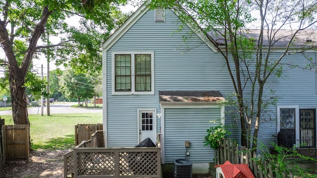 rear view of property with a lawn