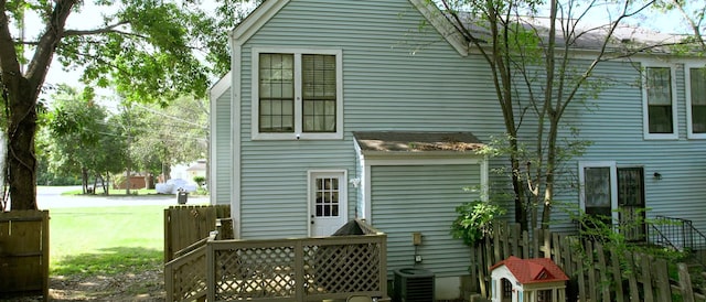 back of house featuring central air condition unit