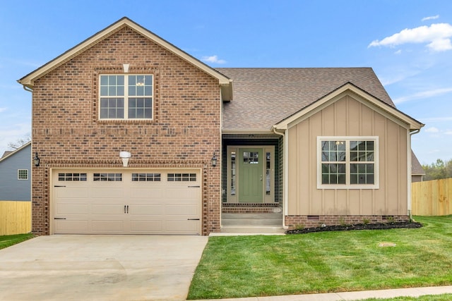 view of front facade with a garage and a front lawn