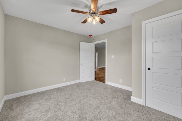 unfurnished bedroom with ceiling fan and carpet