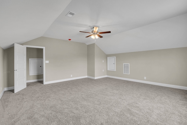 bonus room with ceiling fan, light carpet, and vaulted ceiling