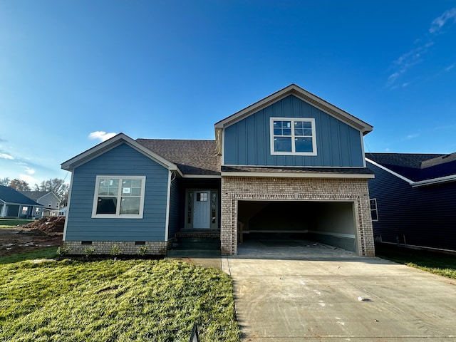 view of front facade with a front yard and a garage