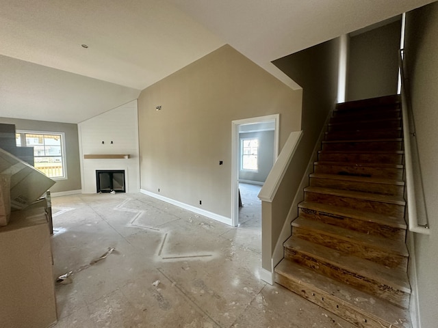 stairway with vaulted ceiling