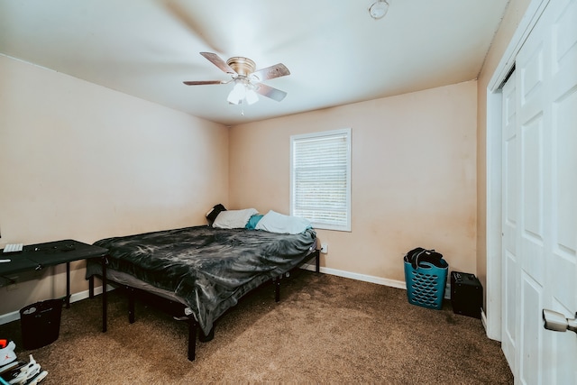 carpeted bedroom featuring ceiling fan and a closet