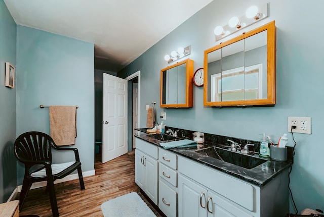 bathroom featuring vanity and hardwood / wood-style flooring