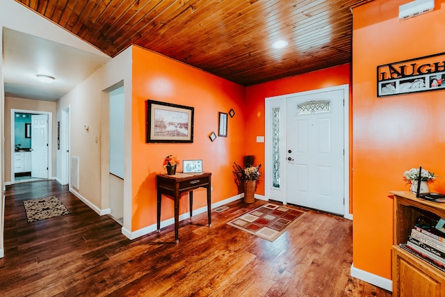 foyer with lofted ceiling, wood-type flooring, and wood ceiling