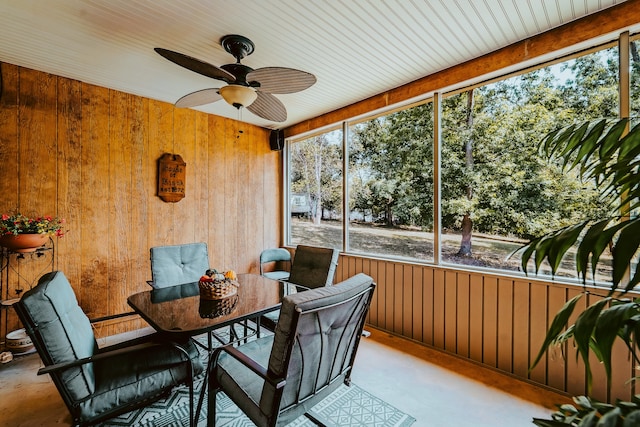 sunroom featuring ceiling fan