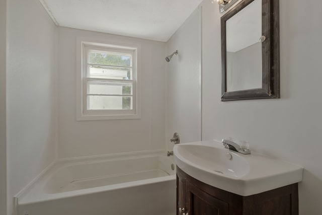 bathroom with vanity and washtub / shower combination