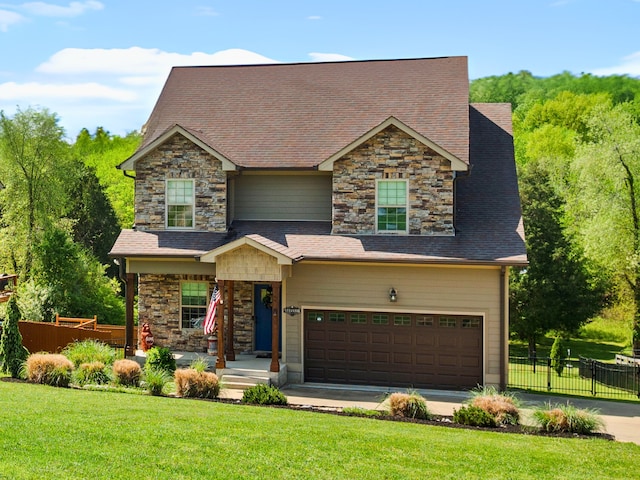 view of front of home with a garage and a front yard