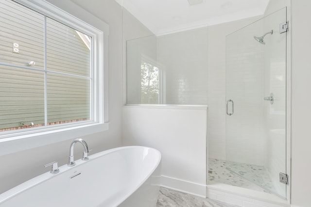 bathroom featuring shower with separate bathtub