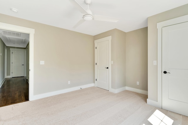 unfurnished bedroom with light carpet and ceiling fan