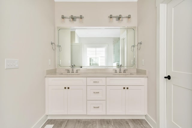 bathroom with vanity and hardwood / wood-style floors