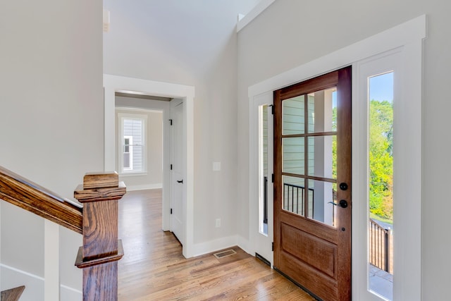 entrance foyer featuring light hardwood / wood-style flooring and plenty of natural light