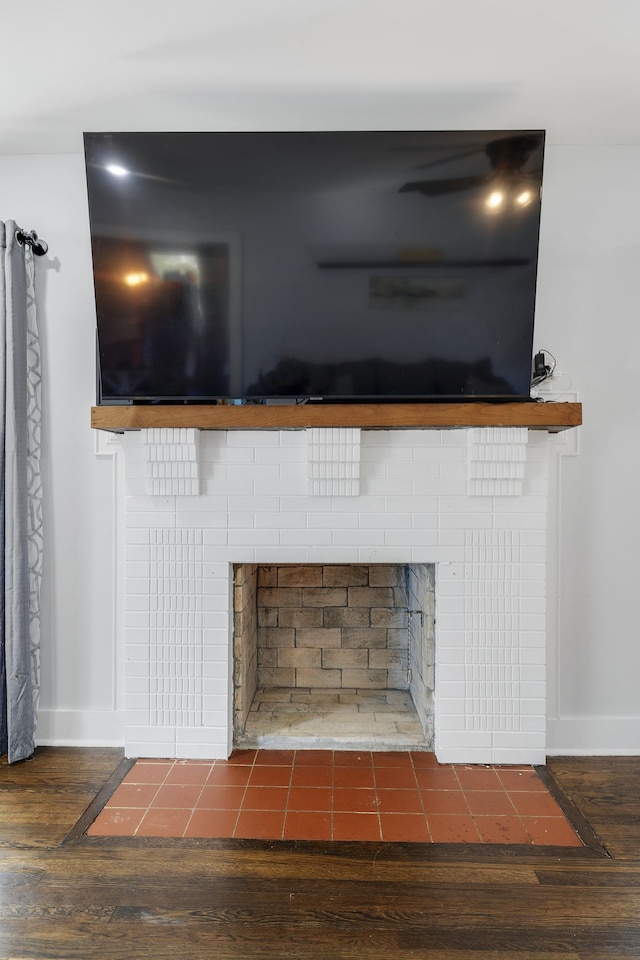 details with a fireplace and wood-type flooring