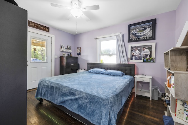 bedroom with ceiling fan and dark hardwood / wood-style flooring