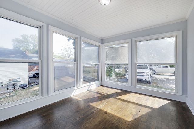 unfurnished sunroom featuring wooden ceiling and a healthy amount of sunlight