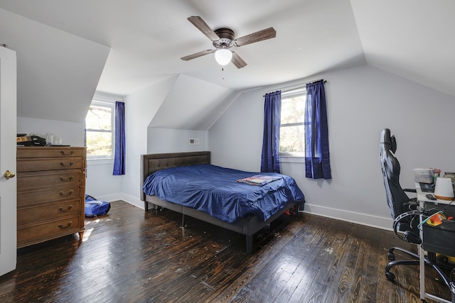 bedroom with multiple windows, ceiling fan, dark hardwood / wood-style flooring, and vaulted ceiling