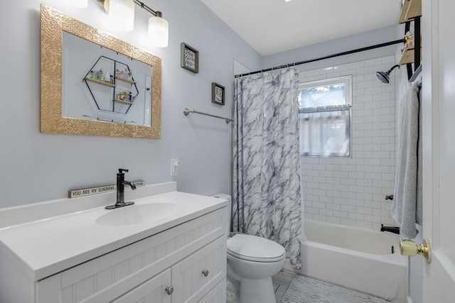 full bathroom featuring vanity, shower / tub combo, and toilet