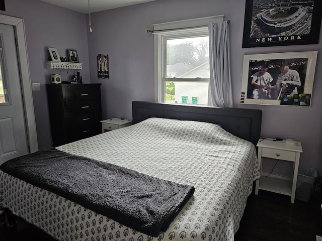 bedroom featuring dark wood-type flooring