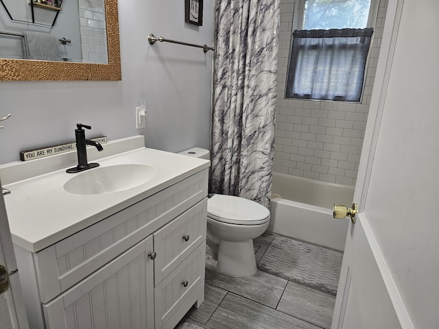 full bathroom with toilet, vanity, and shower / tub combo with curtain