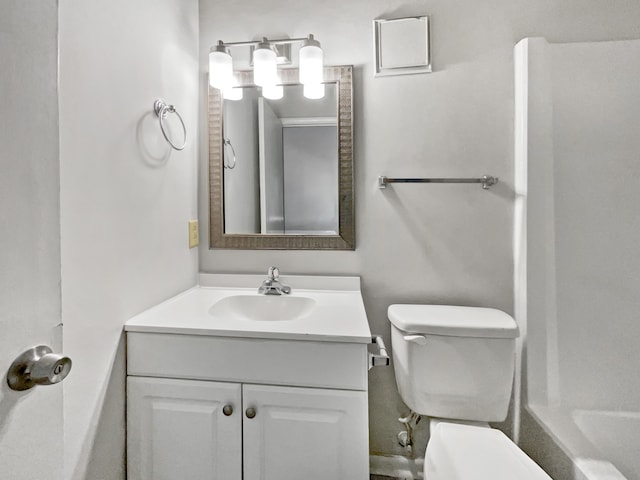 bathroom featuring vanity and toilet