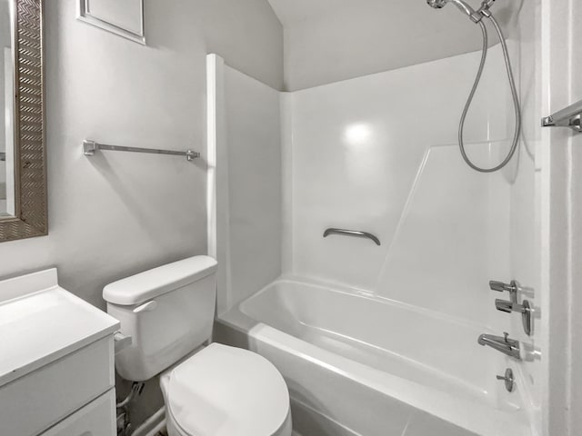 full bath featuring toilet, bathing tub / shower combination, and vanity