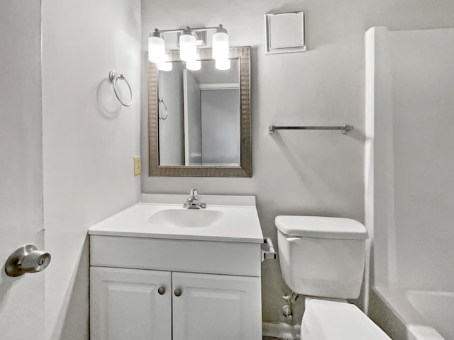 bathroom with toilet and vanity