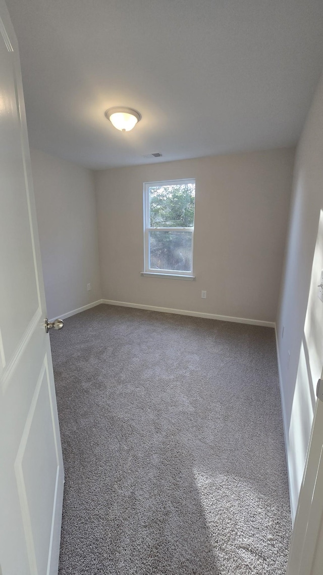 unfurnished room featuring carpet floors