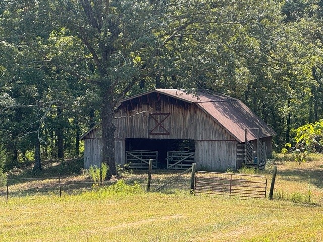 view of outbuilding with a lawn