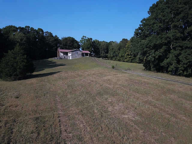 view of yard with a rural view