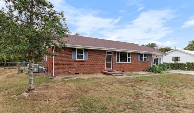 ranch-style home with a front lawn