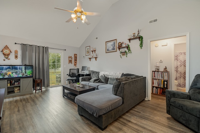 living room with ceiling fan, high vaulted ceiling, and hardwood / wood-style floors