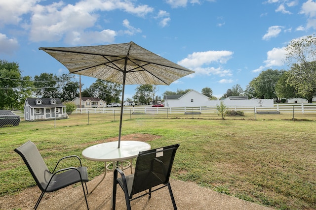 view of patio featuring an outbuilding