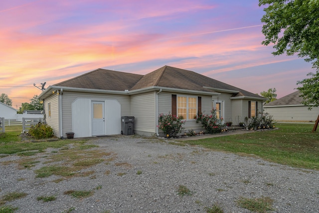 view of front of house with a yard