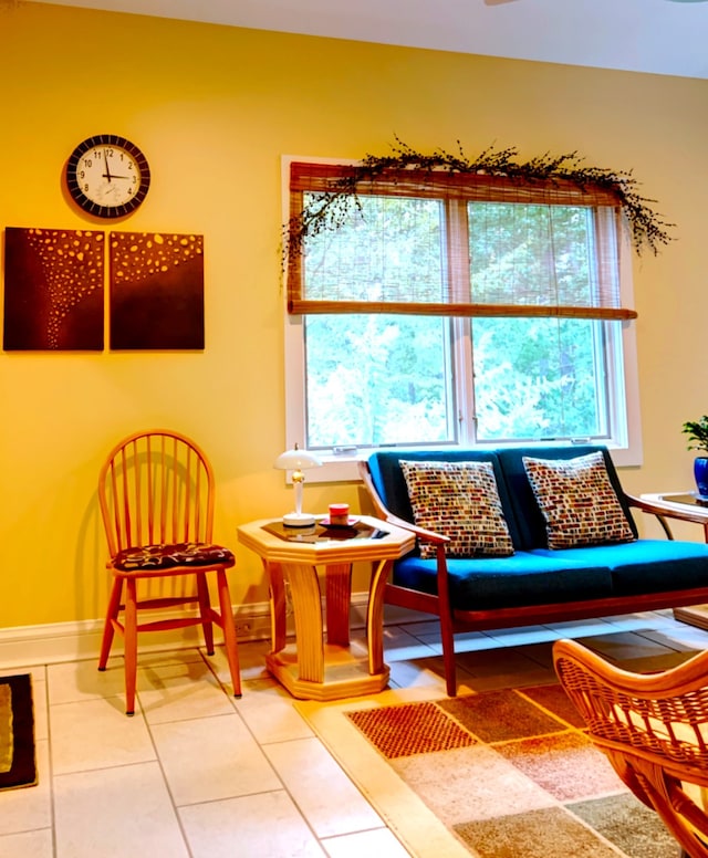 sitting room with a healthy amount of sunlight and tile patterned flooring