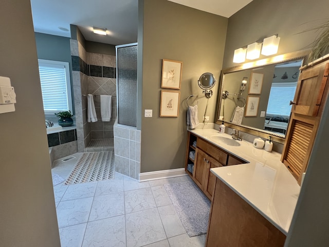 bathroom with tile patterned floors, independent shower and bath, and vanity