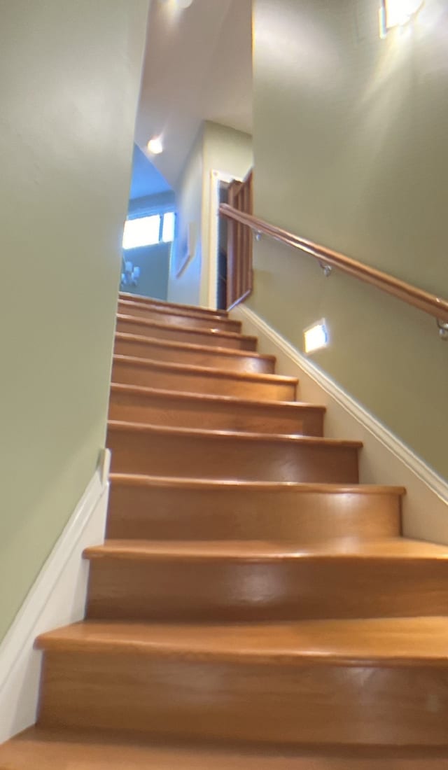 stairs with lofted ceiling