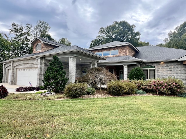 view of front of property featuring a garage and a front yard