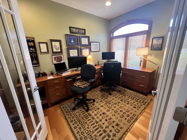 office space with light hardwood / wood-style flooring