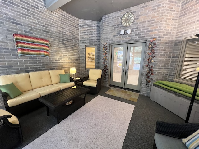 living room featuring brick wall and french doors