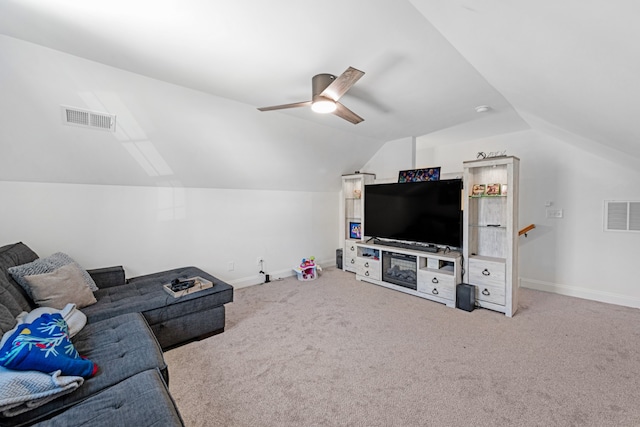 living room featuring lofted ceiling, ceiling fan, and carpet flooring