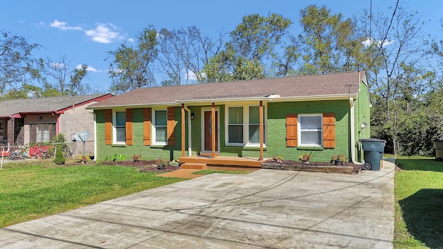 ranch-style home with a porch and a front yard