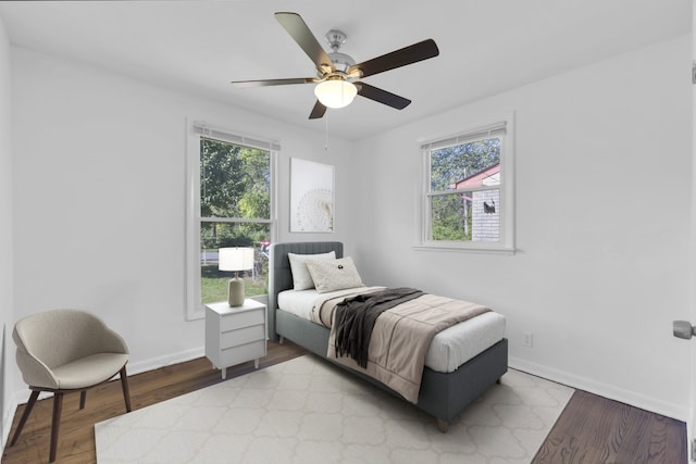 bedroom with light wood-type flooring and ceiling fan