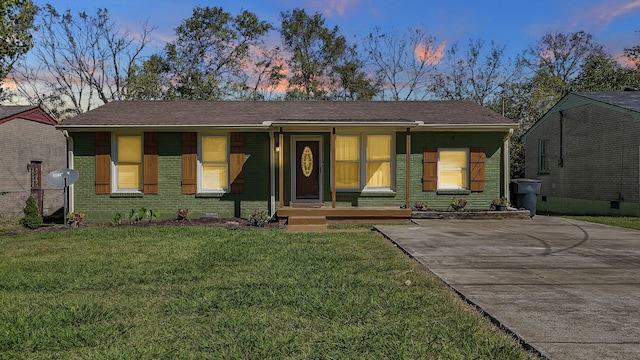 view of front facade with a yard and a porch