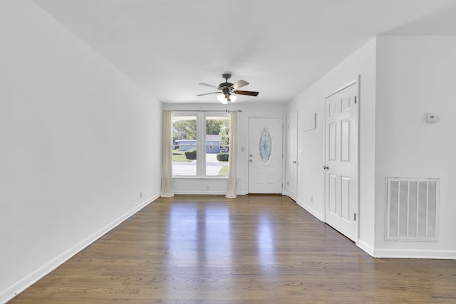 foyer entrance with ceiling fan and dark hardwood / wood-style floors