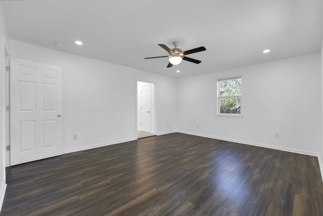 unfurnished room featuring dark hardwood / wood-style floors and ceiling fan