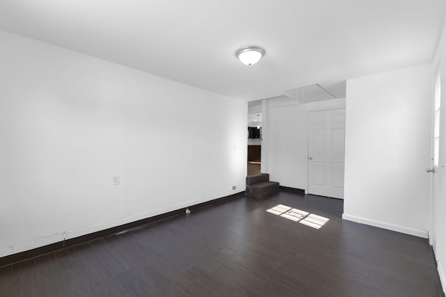 empty room with dark hardwood / wood-style floors