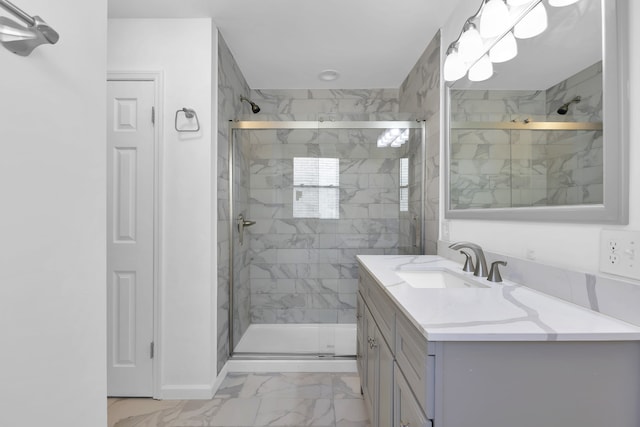 bathroom with vanity and a shower with shower door