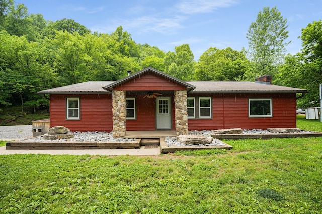 back of house with a yard